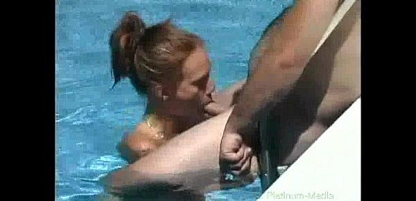  Milf gives blowjob on big hard cock outdoors in pool